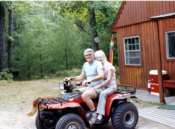 1991-08xx - Jerry-Gladys Confer on Quad at back cabin